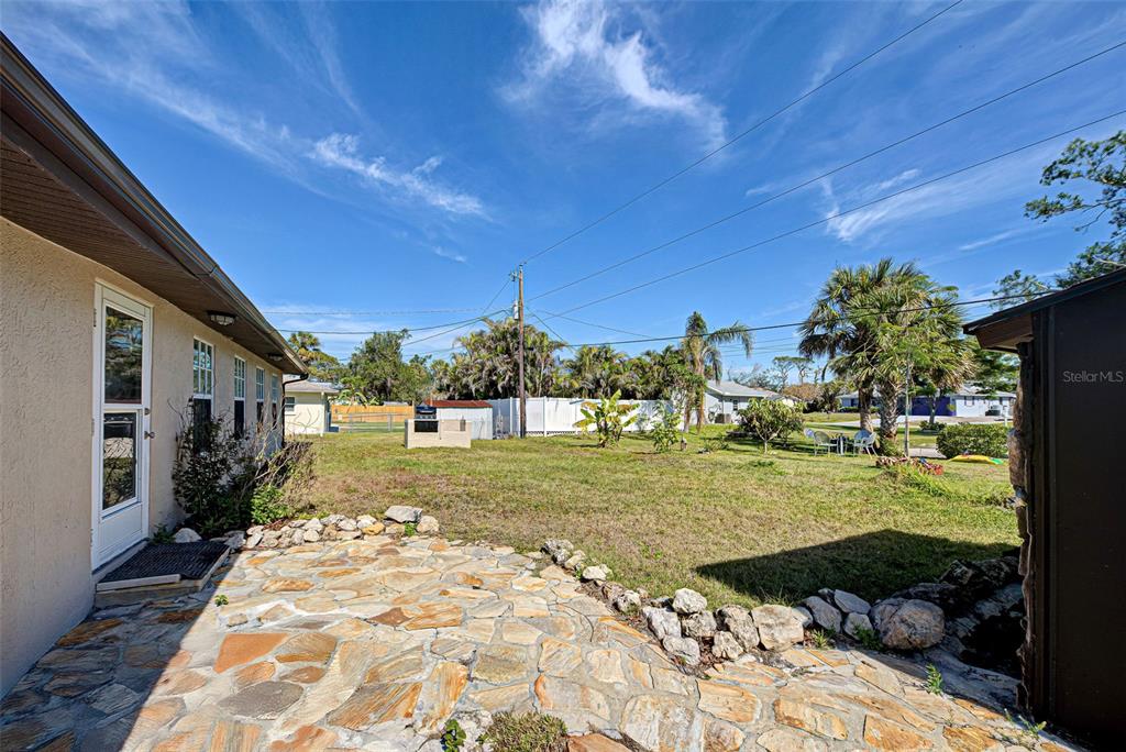 3187 Galiot Road Venice, FL 34293 - Photo 43 of 46 a view of a backyard with large trees
