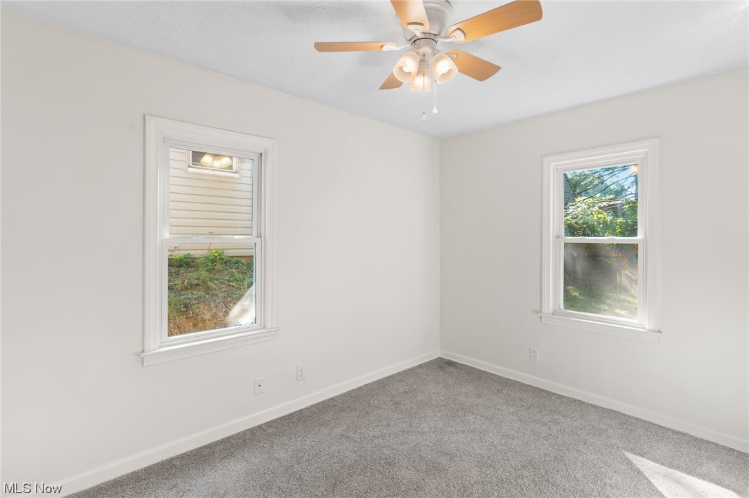 898 Reed Avenue Akron, OH 44306 - Photo 20 of 26 Spare room with light carpet and ceiling fan