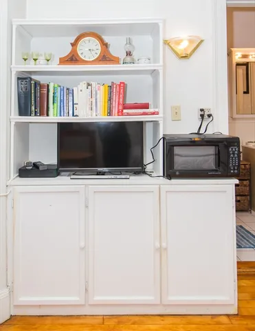 a kitchen with a stove and a microwave
