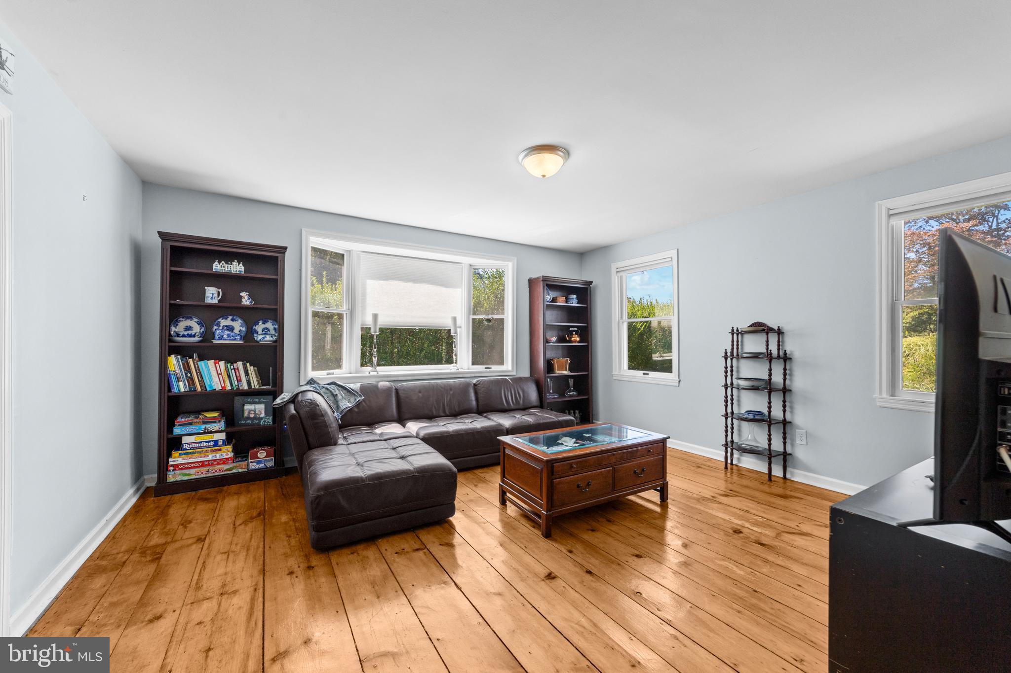 72 Poor Farm Road Pennington, NJ 08534 - Photo 18 of 38 a living room with furniture and a flat screen tv