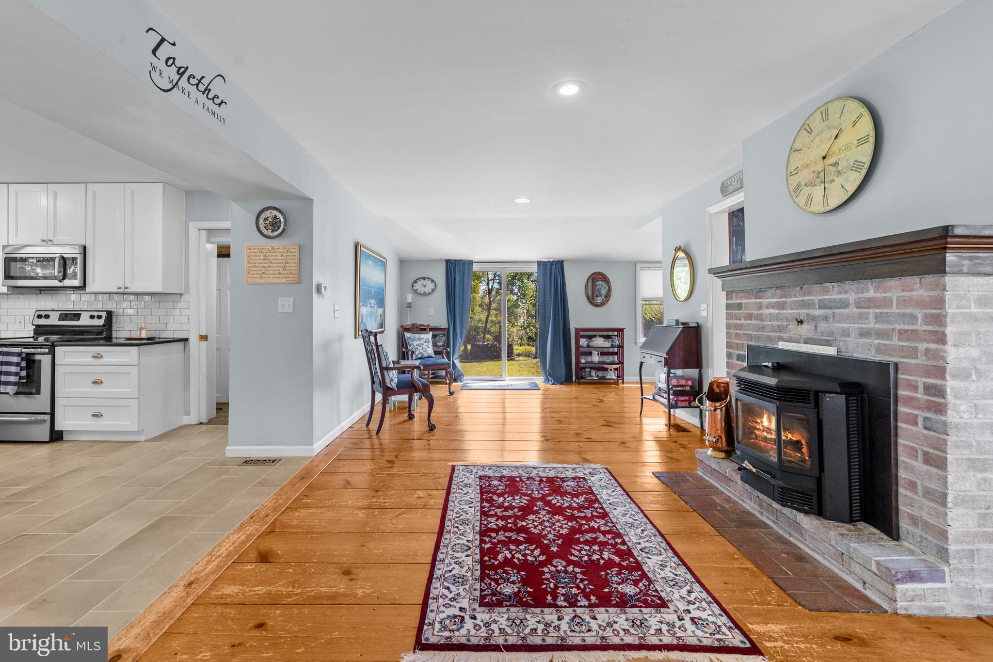 72 Poor Farm Road Pennington, NJ 08534 - Photo 20 of 38 a living room with furniture and a fireplace