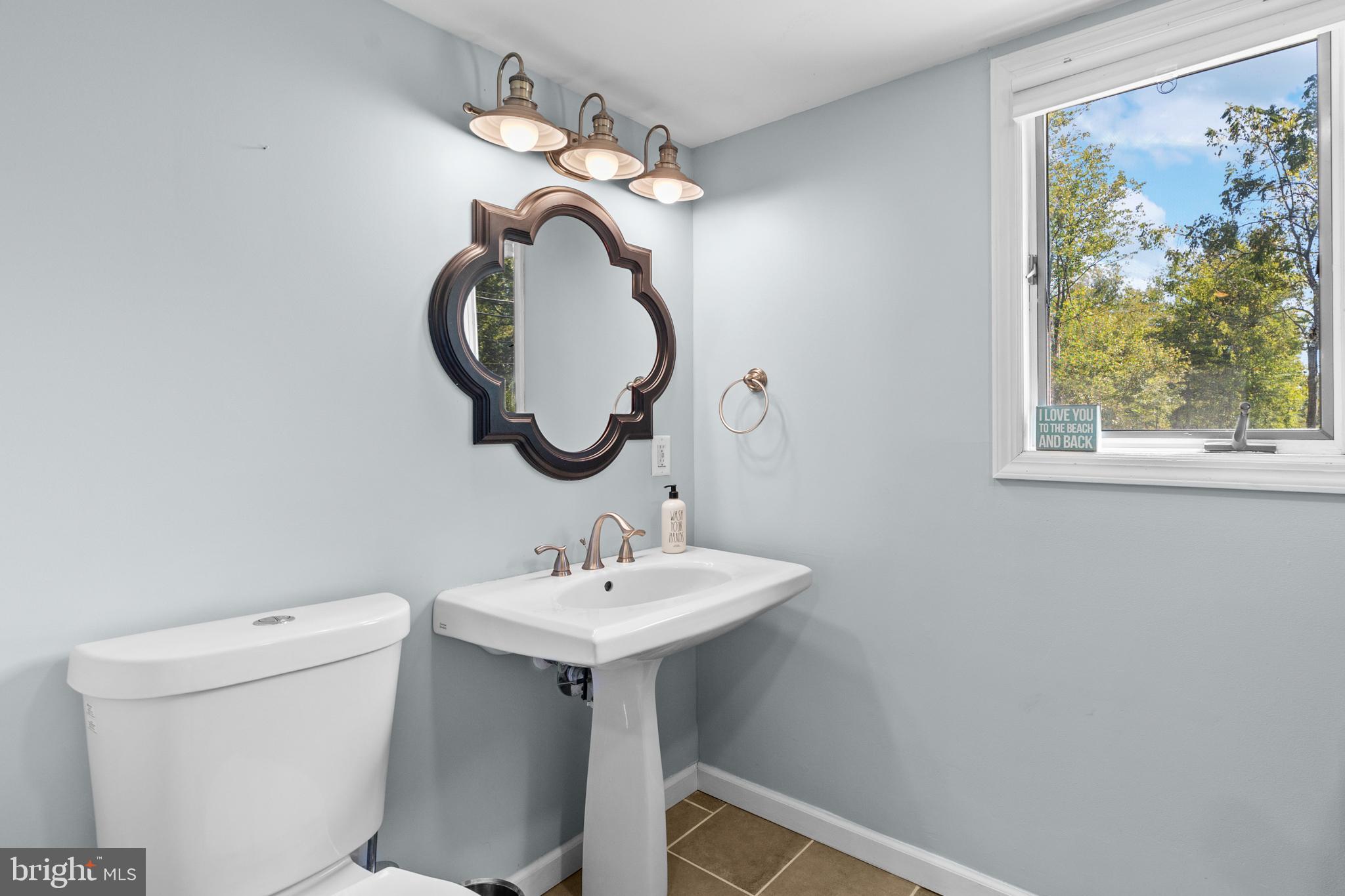 72 Poor Farm Road Pennington, NJ 08534 - Photo 21 of 38 a bathroom with a sink and a mirror