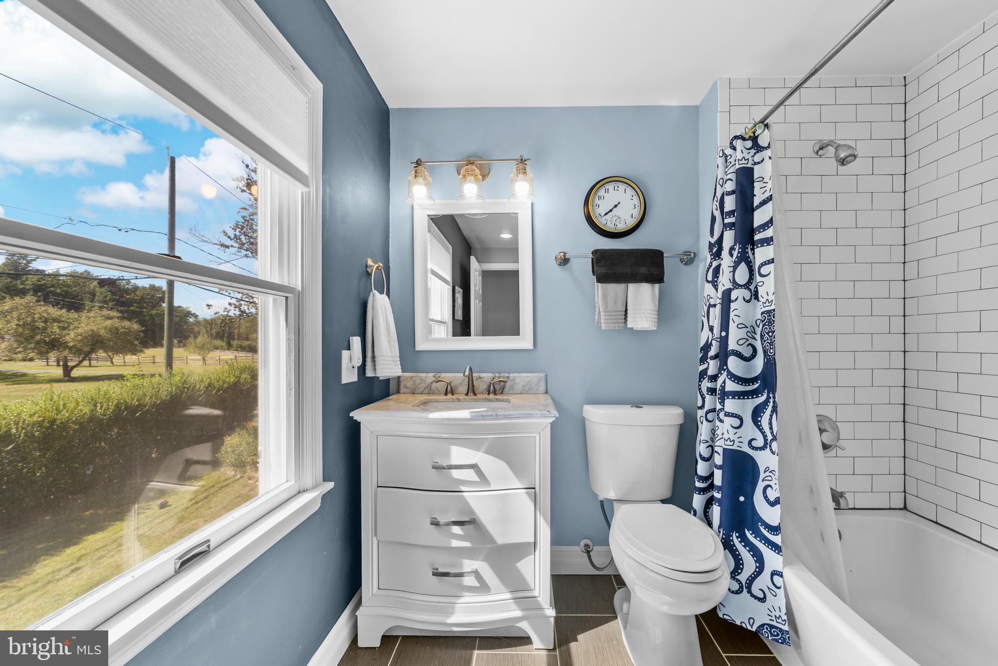 72 Poor Farm Road Pennington, NJ 08534 - Photo 24 of 38 a bathroom with a toilet sink and mirror
