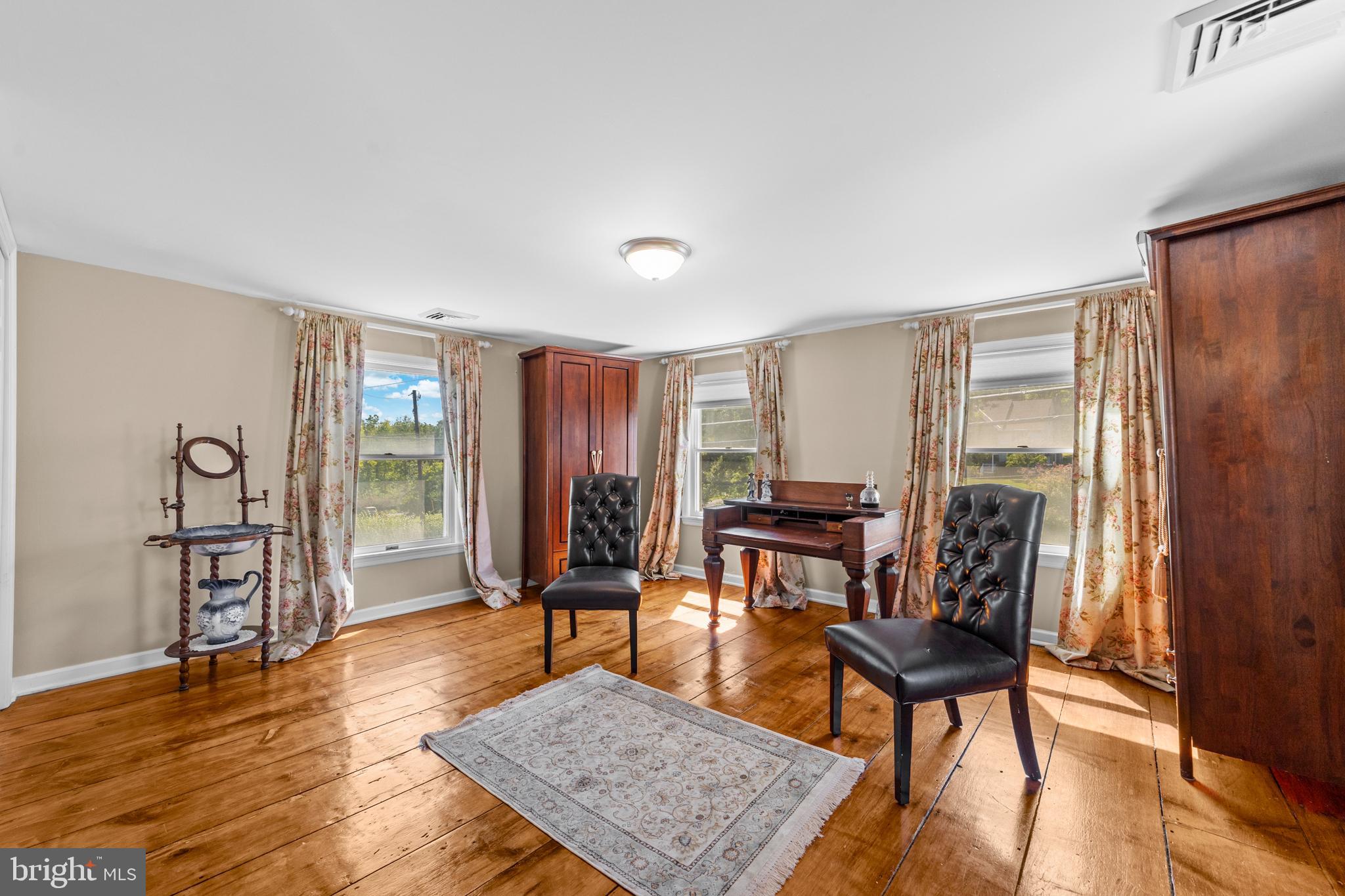72 Poor Farm Road Pennington, NJ 08534 - Photo 25 of 38 a view of a livingroom with furniture and wooden floor