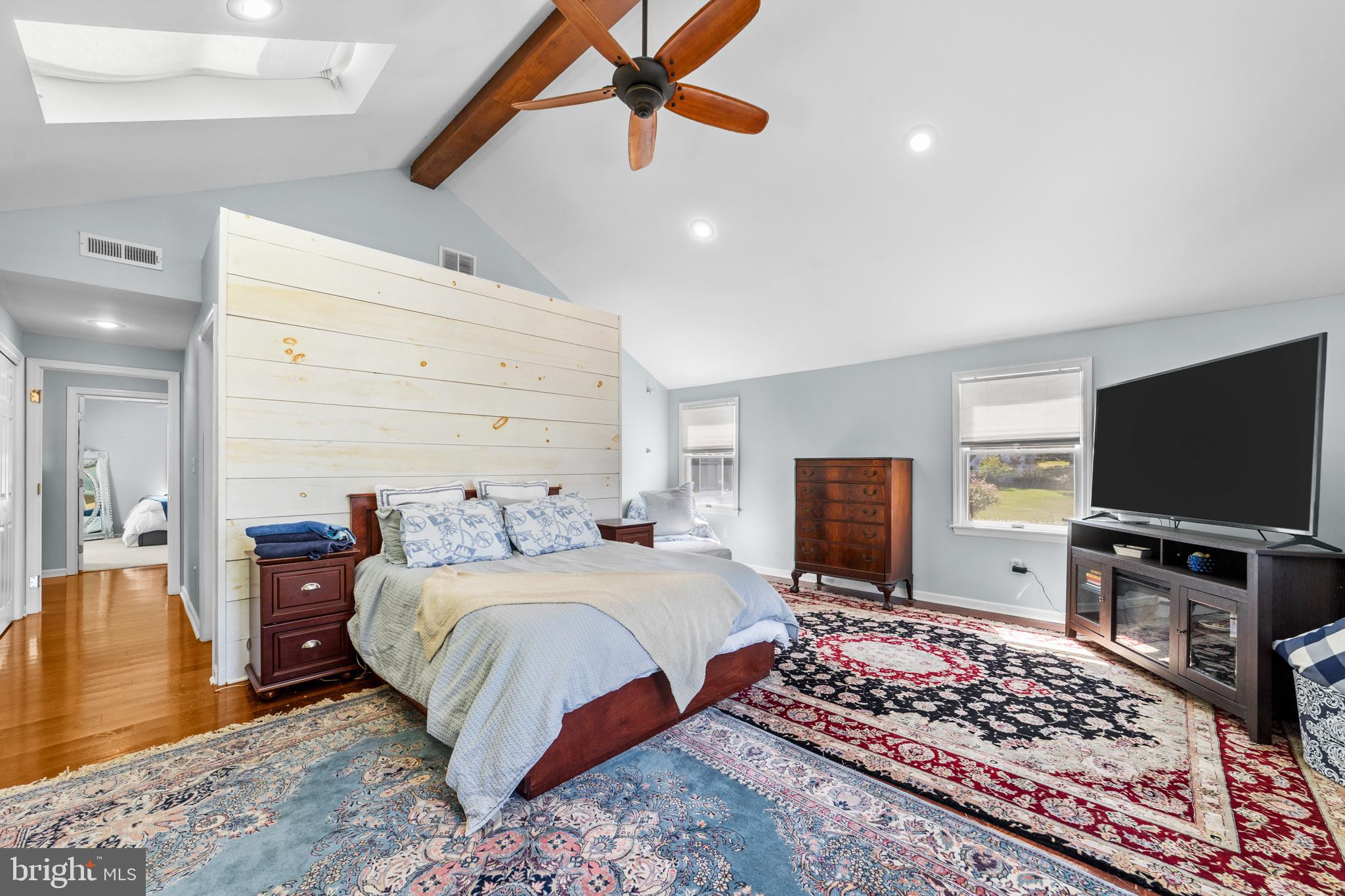 72 Poor Farm Road Pennington, NJ 08534 - Photo 30 of 38 a bedroom with a bed and a flat screen tv