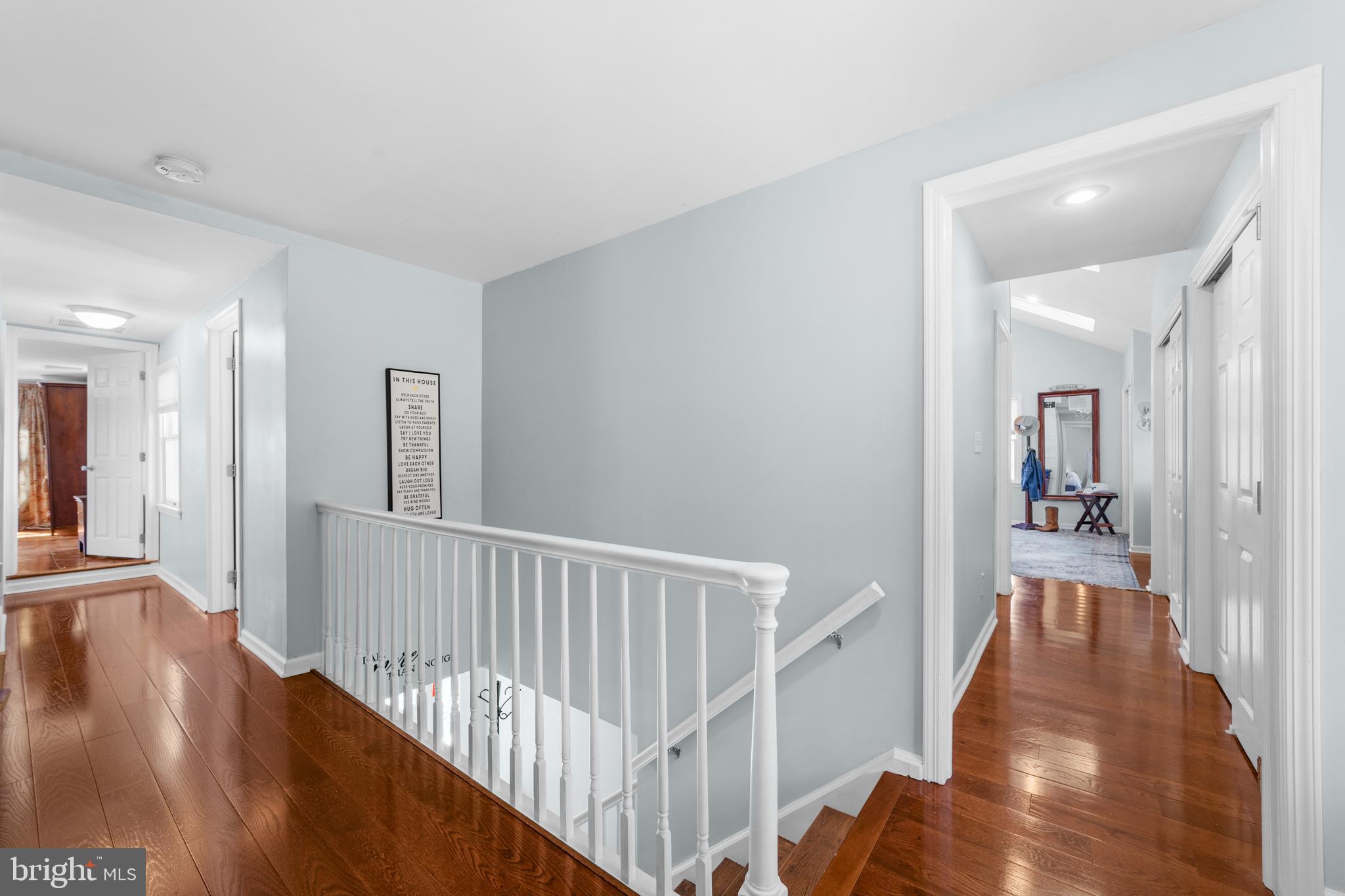 72 Poor Farm Road Pennington, NJ 08534 - Photo 33 of 38 a view of a hallway with wooden floor and stairs