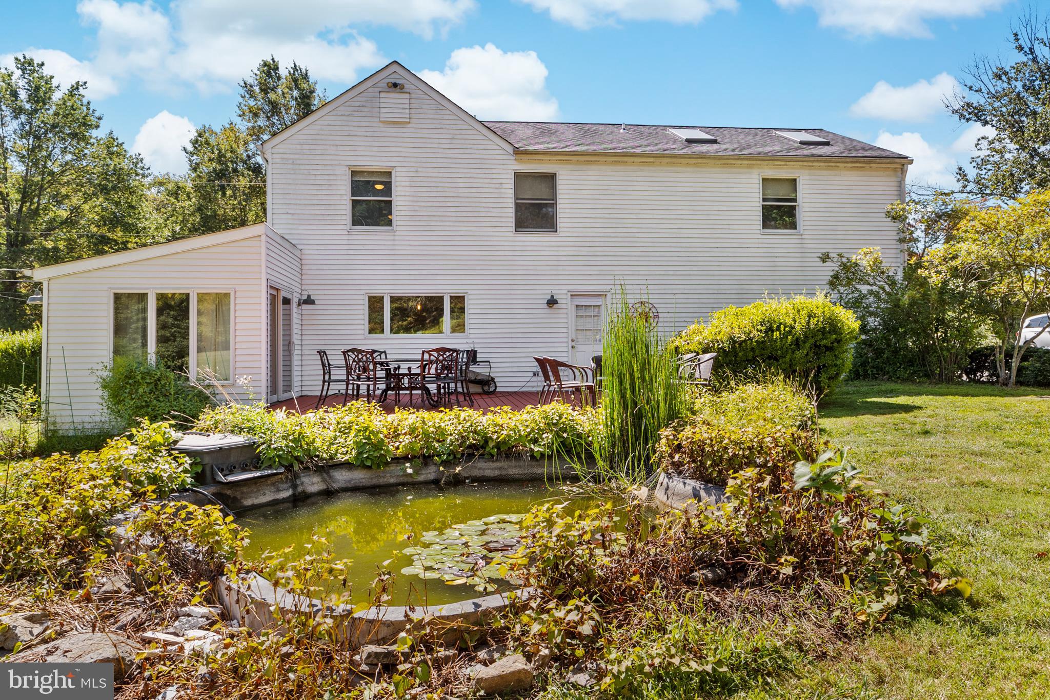 72 Poor Farm Road Pennington, NJ 08534 - Photo 35 of 38 a front view of house with garden and swimming pool