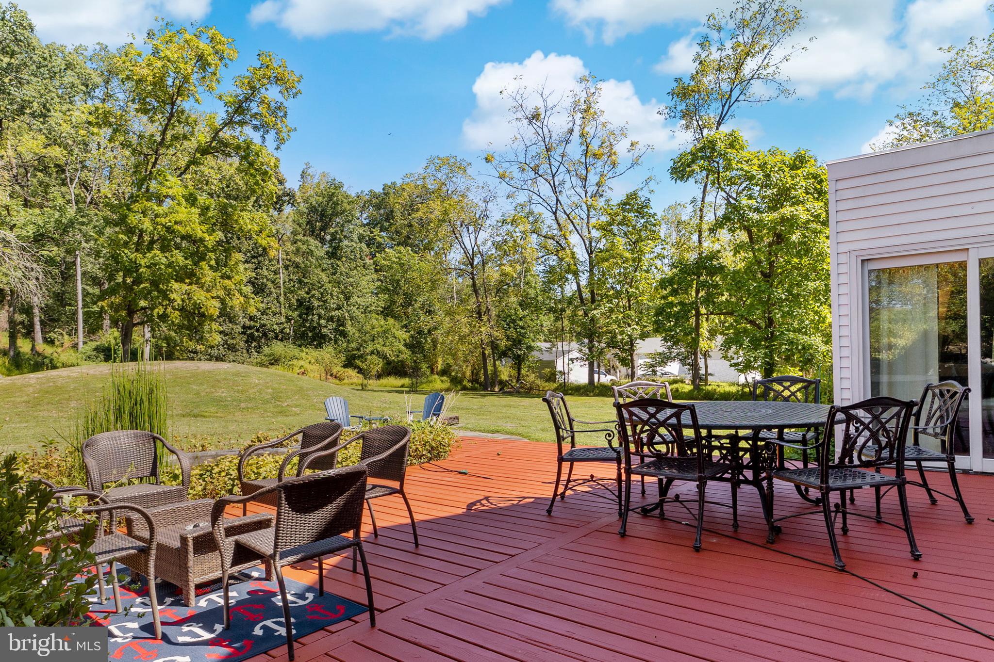 72 Poor Farm Road Pennington, NJ 08534 - Photo 36 of 38 a view of a terrace with furniture and wooden floor