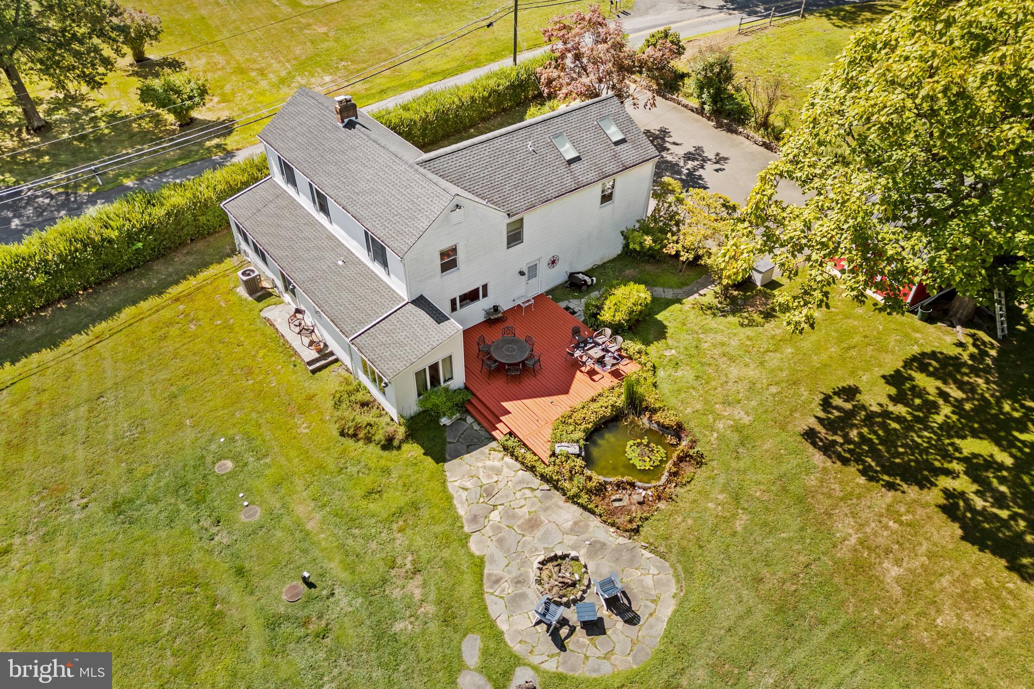 72 Poor Farm Road Pennington, NJ 08534 - Photo 8 of 38 an aerial view of a house with a yard swimming pool and outdoor seating
