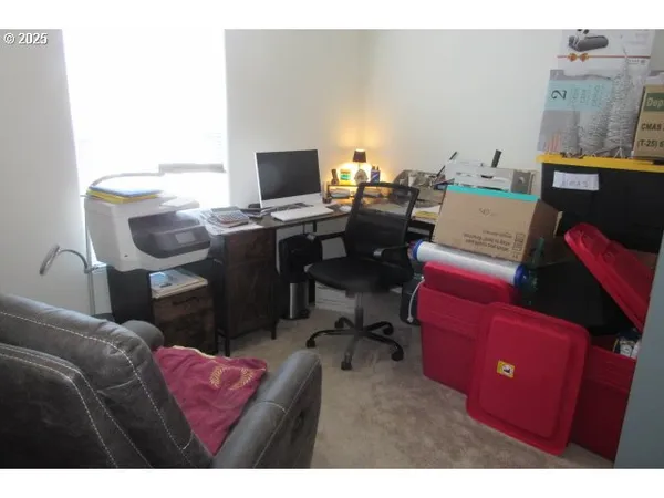 a view of a workspace with furniture