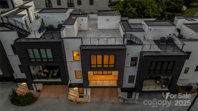 a view of a patio with table and chairs and potted plants