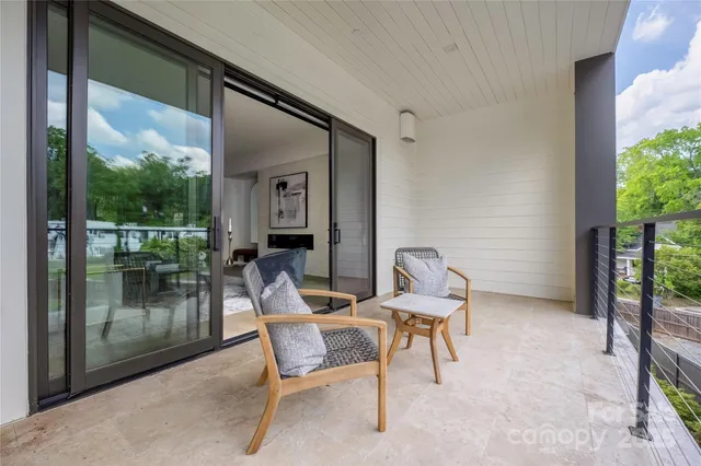 a view of an outdoor sitting space with furniture