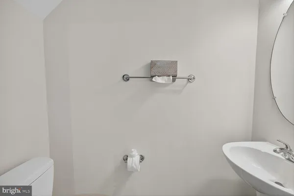 a bathroom with a sink and mirror