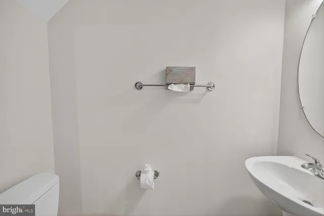 a bathroom with a sink and mirror