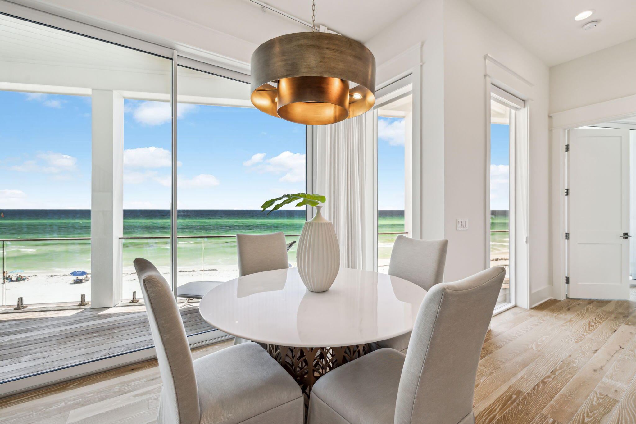 323 Pompano St Inlet Beach Inlet Beach, FL 32461 - Photo 17 of 79 a dining room with furniture and a floor to ceiling window