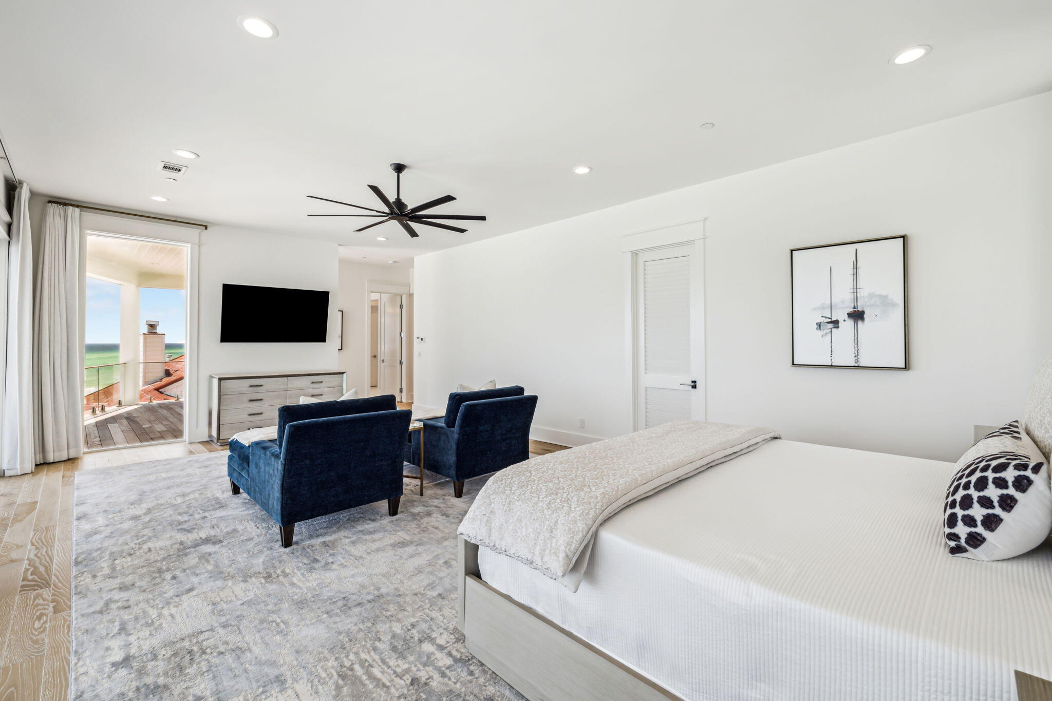 323 Pompano St Inlet Beach Inlet Beach, FL 32461 - Photo 32 of 79 a spacious bedroom with a bed and a flat screen television