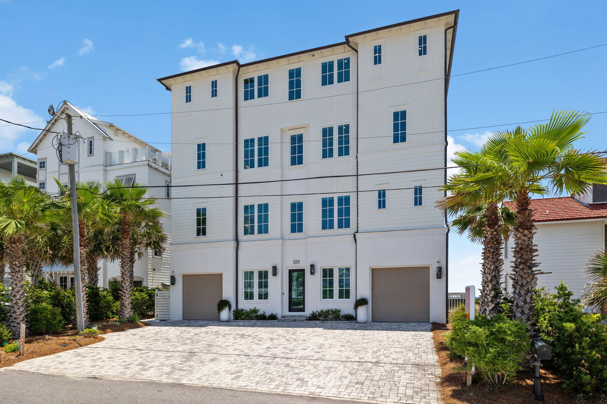 323 Pompano St Inlet Beach Inlet Beach, FL 32461 - Photo 76 of 79 a view of a white building among the street with palm trees