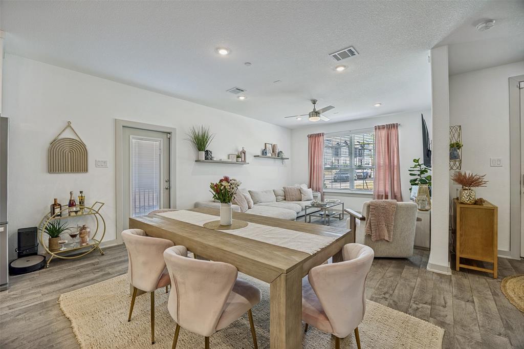 1650 Jessica Lane Allen, TX 75002 - Photo 6 of 25 a view of a dining room with furniture and a chandelier