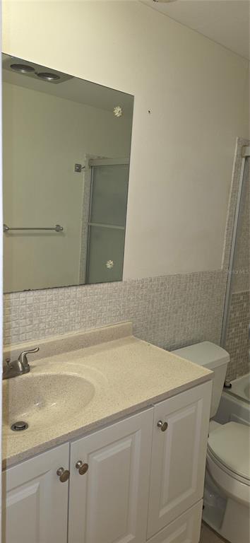 911 Washington Avenue Southwest, Unit 304 Largo, FL 33770 - Photo 18 of 26 a bathroom with a sink and a toilet