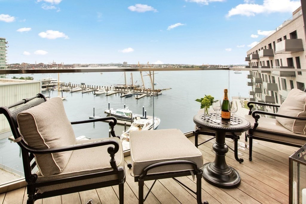 300 Pier 4 Blvd., Unit 8N Boston, MA 02210 - Photo 15 of 37 a balcony with furniture and view of lake