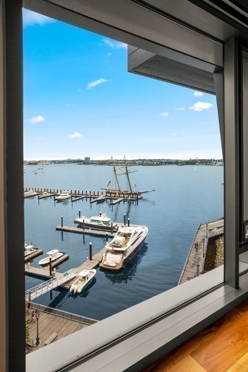 300 Pier 4 Blvd., Unit 8N Boston, MA 02210 - Photo 21 of 37 a room with furniture and view of lake