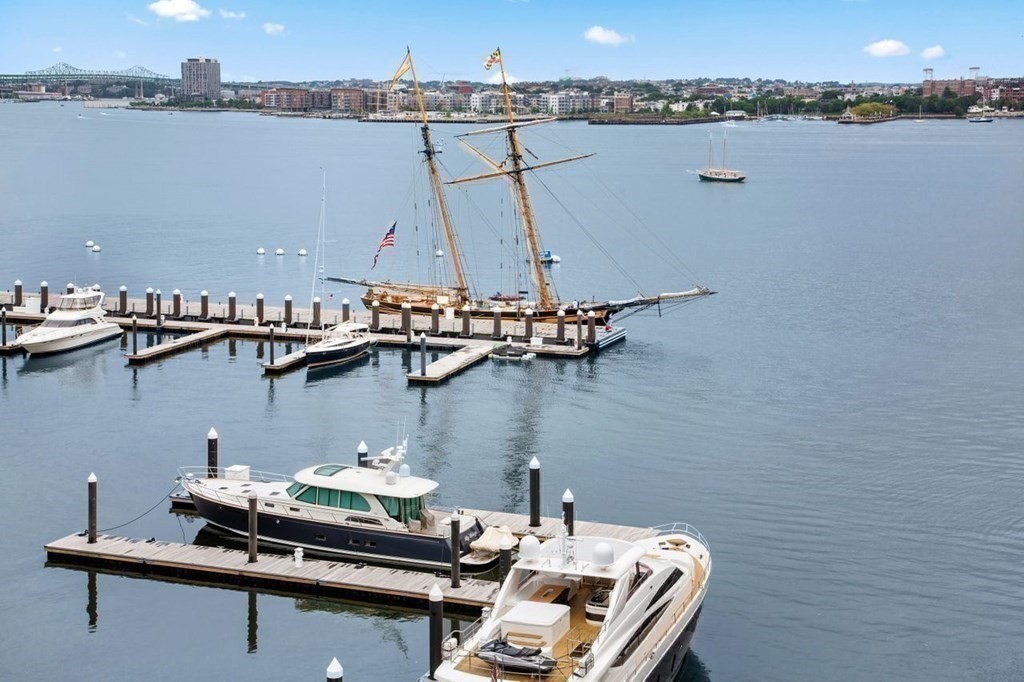 300 Pier 4 Blvd., Unit 8N Boston, MA 02210 - Photo 27 of 37 a couple of boats are docked in a harbor
