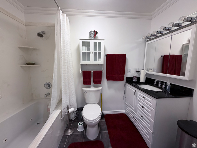 2855 South 1000 West Perry, UT 84302 - Photo 118 of 142 Full bath with crown molding, vanity, a combined bath / shower with jetted tub, and dark tile patterned floors