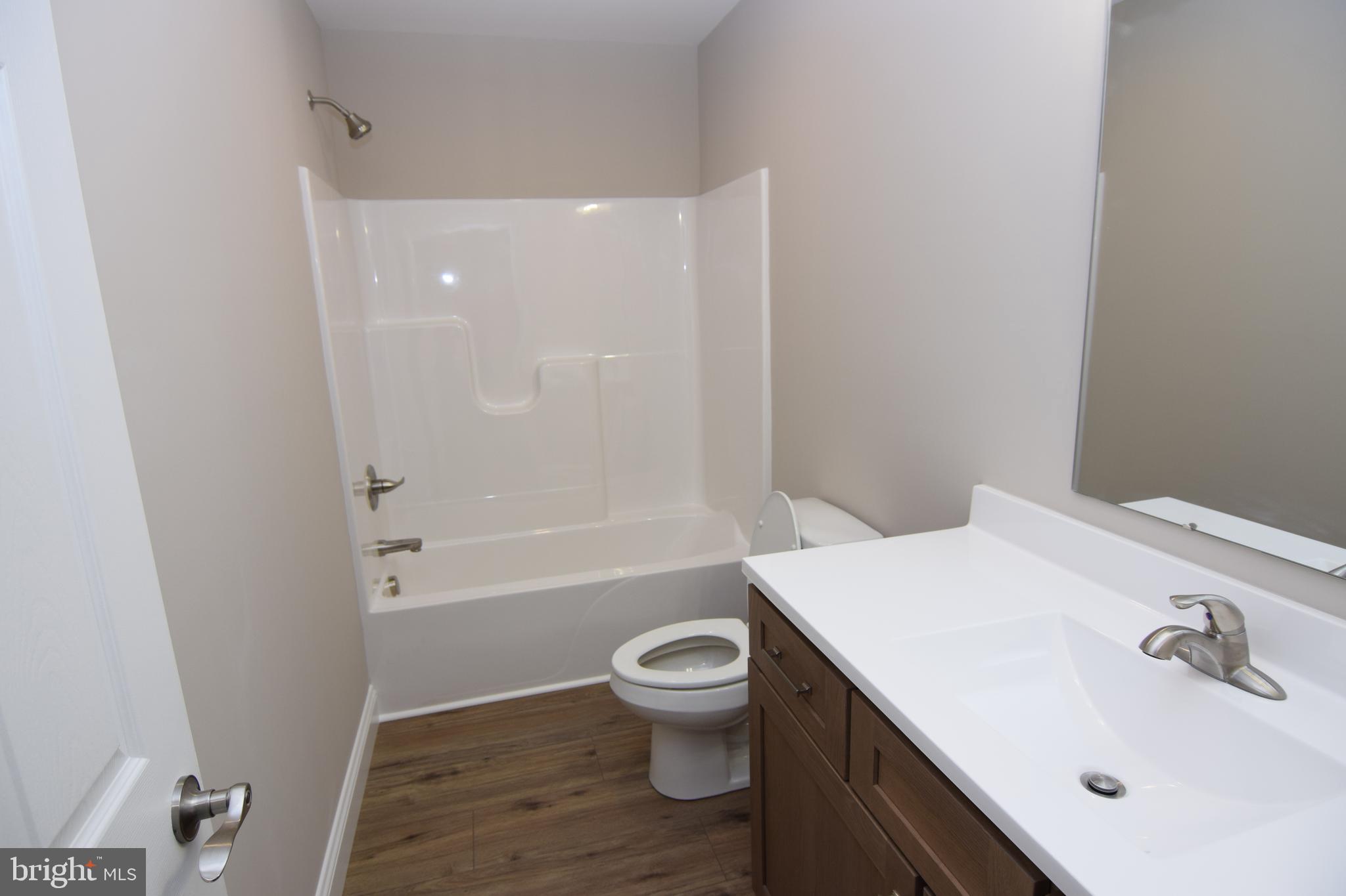 1 Briarhook Road Seaford, DE 19973 - Photo 11 of 15 a bathroom with a sink a toilet and shower