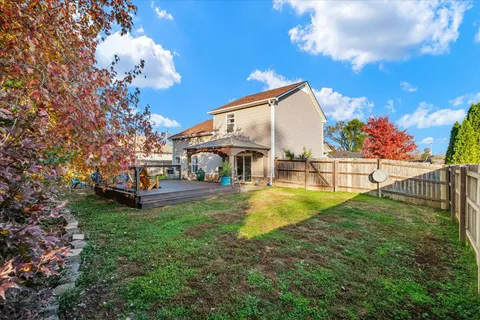 a view of yard with swimming pool and sitting area