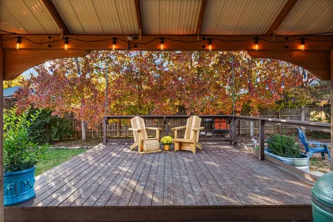 a view of a chairs and table in the patio