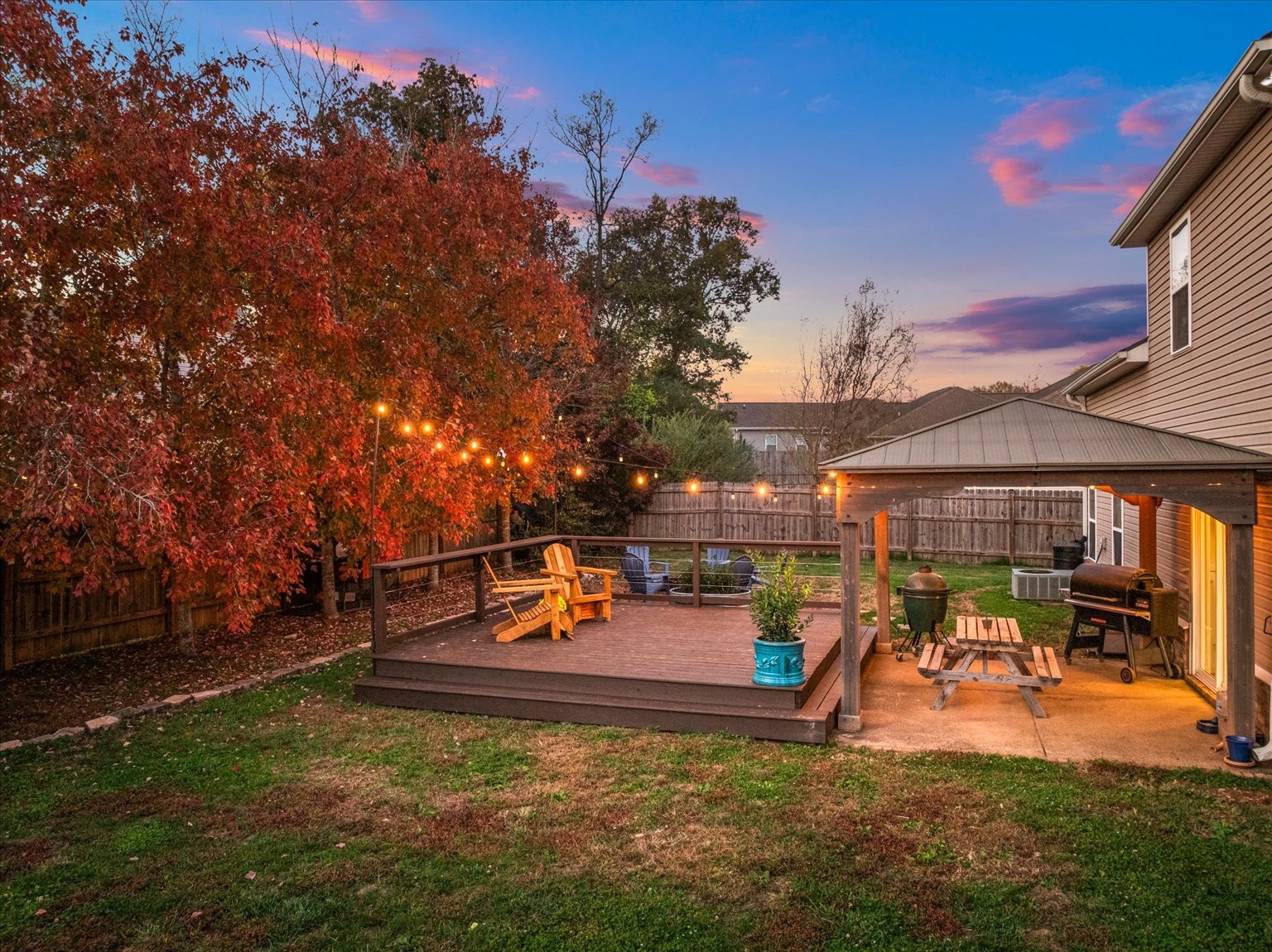 5001 Morning Dove Lane Spring Hill, TN 37174 - Photo 17 of 21 a view of a patio with table and chairs under an umbrella
