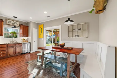 a view of a dining room with furniture window and wooden floor