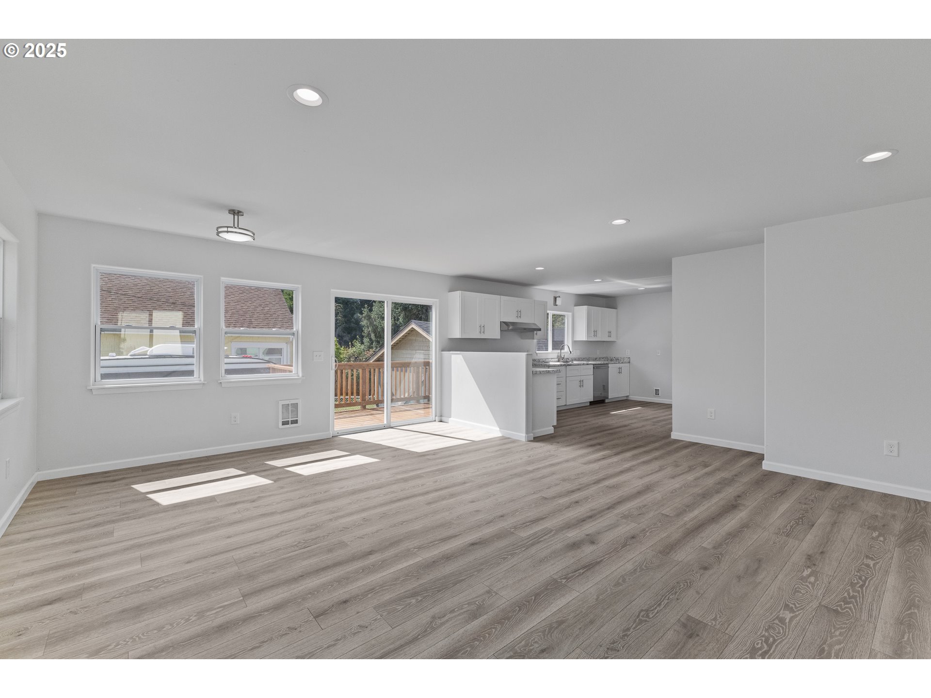 1175 North Dean Street Coquille, OR 97423 - Photo 11 of 34 a view of empty room with wooden floor and window