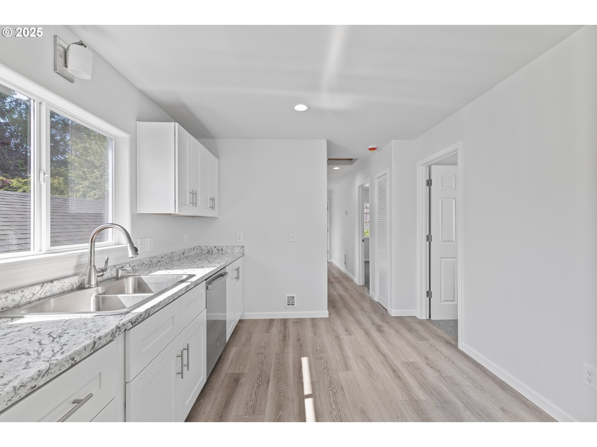 1175 North Dean Street Coquille, OR 97423 - Photo 15 of 34 a kitchen with a sink cabinets and wooden floor
