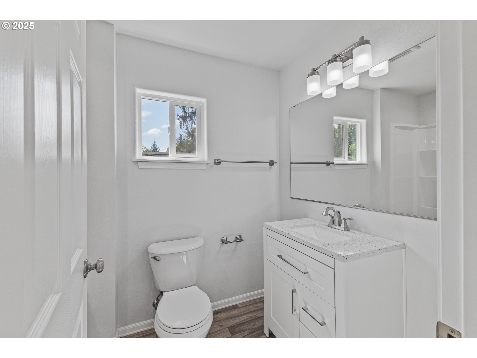 1175 North Dean Street Coquille, OR 97423 - Photo 23 of 34 a bathroom with a toilet sink and mirror