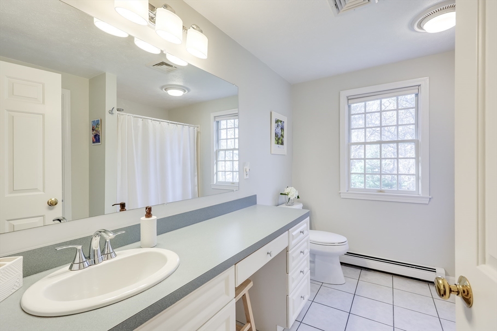 2 Briar Patch Circle Sandwich, MA 02537 - Photo 32 of 42 a bathroom with a sink a toilet a large mirror and a window