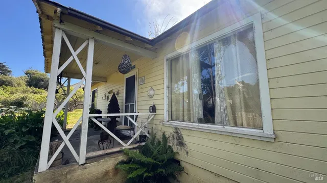 a house with trees in front of it