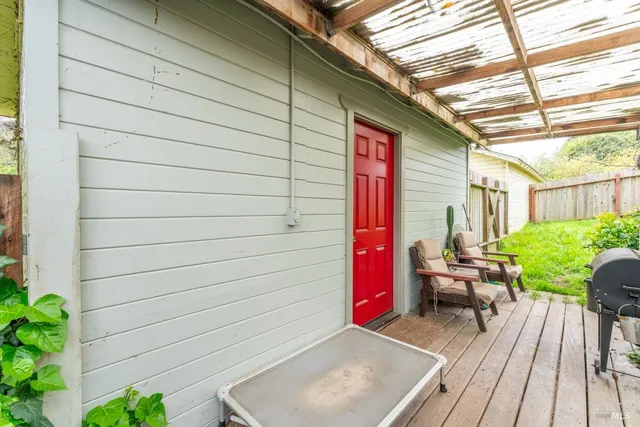 a backyard of a house with seating space