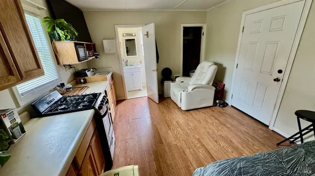 a bedroom with furniture and a window