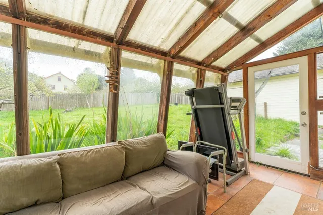 a living room with large windows