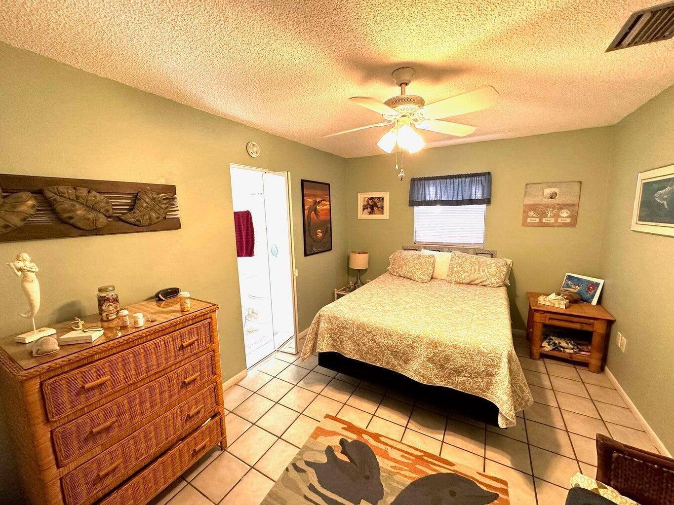 410 Mahogany Avenue Key Largo, FL 33037 - Photo 11 of 18 a bedroom with a bed and furniture