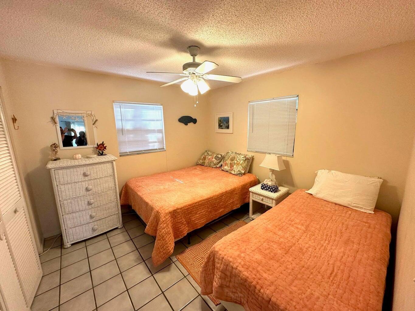 410 Mahogany Avenue Key Largo, FL 33037 - Photo 12 of 18 a bedroom with two beds and a dresser