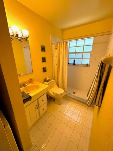 a bathroom with a sink a toilet and tub