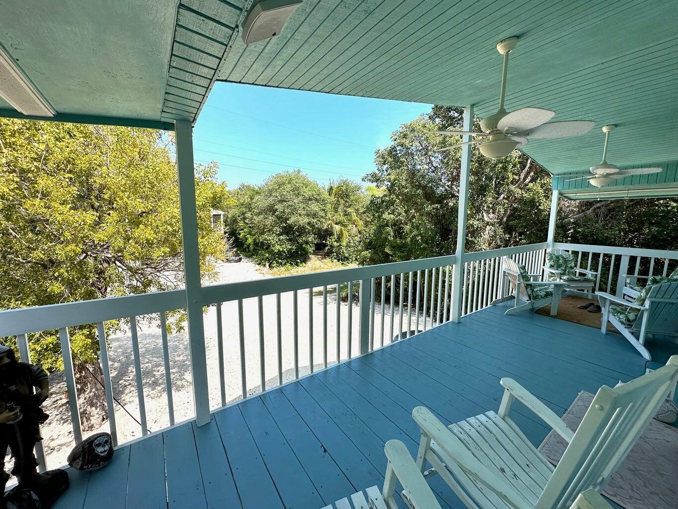 410 Mahogany Avenue Key Largo, FL 33037 - Photo 3 of 18 a view of a balcony with furniture