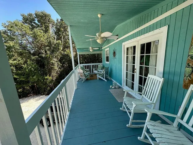 a view of balcony with furniture