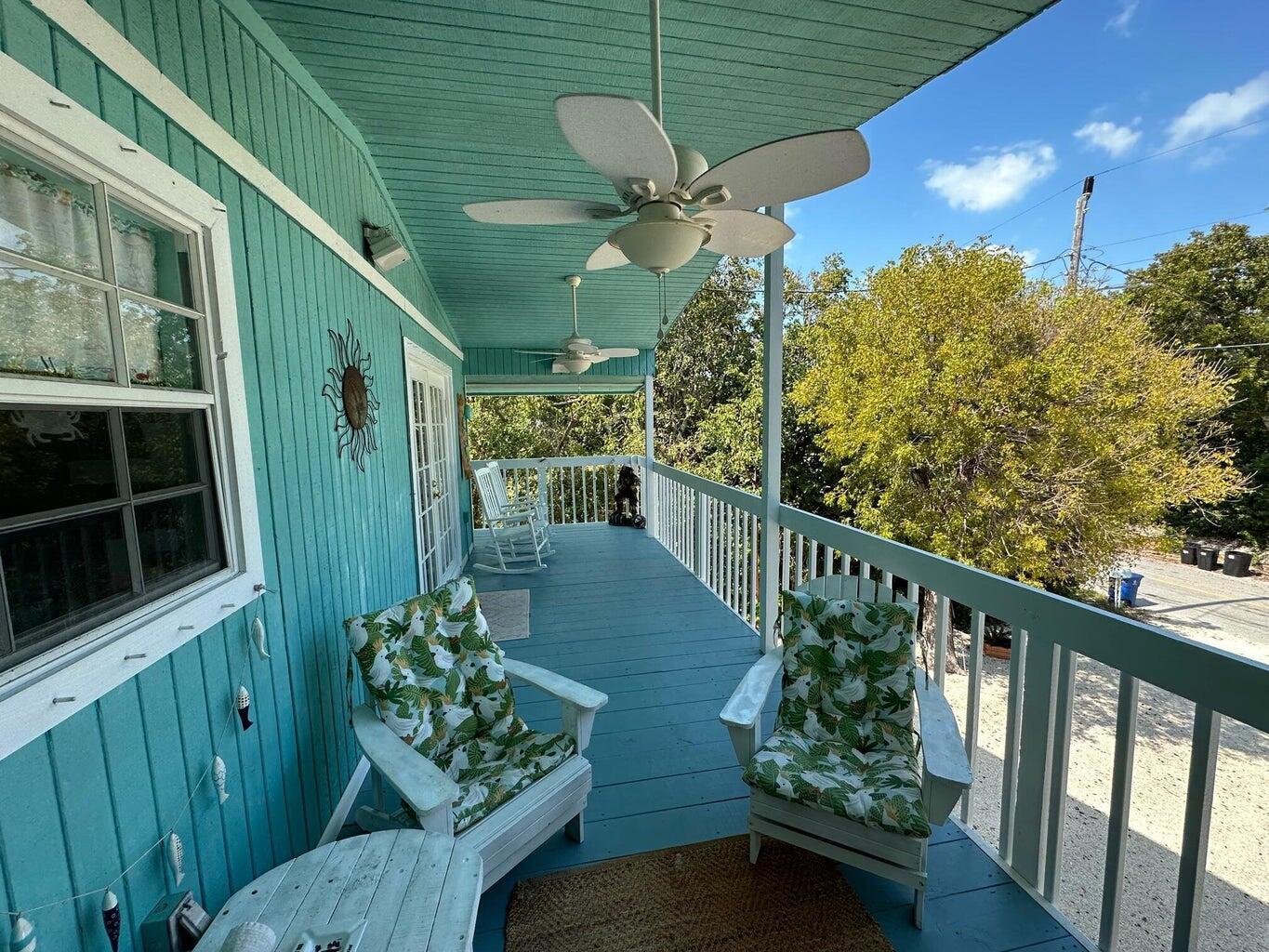 410 Mahogany Avenue Key Largo, FL 33037 - Photo 5 of 18 a view of a balcony with wooden floor
