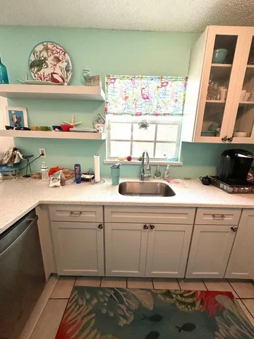 a kitchen with a sink and cabinets