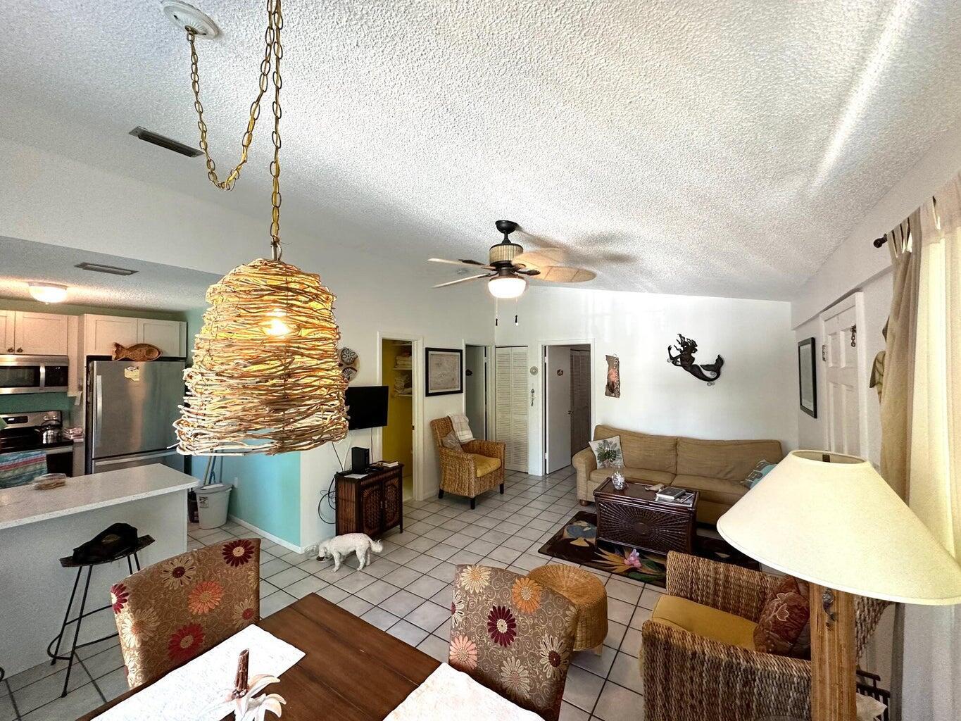 410 Mahogany Avenue Key Largo, FL 33037 - Photo 9 of 18 a living room with furniture and a chandelier