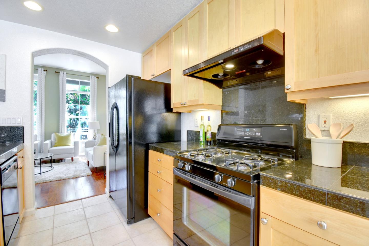 842 Wind Walk Milpitas, CA 95035 - Photo 11 of 45 a kitchen with stainless steel appliances granite countertop a stove a refrigerator and a sink