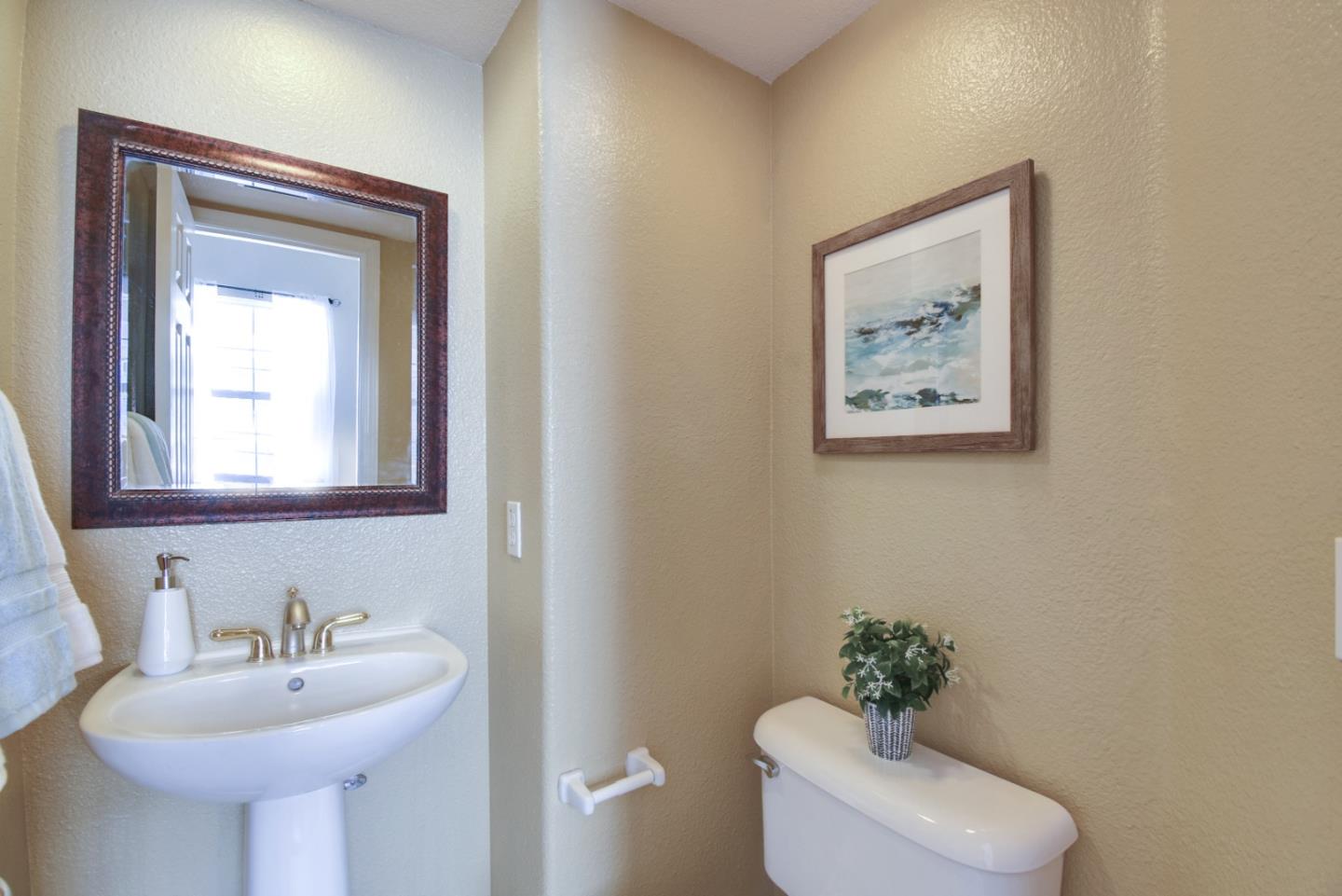 842 Wind Walk Milpitas, CA 95035 - Photo 14 of 45 a bathroom with a toilet sink and mirror